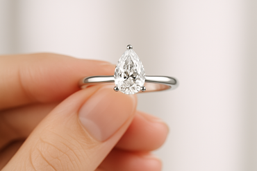 0.6Ct Pear Labgrown Diamond Solitaire Engagement Ring - in hand