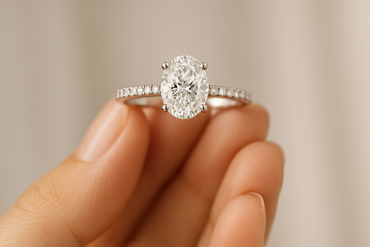 1ct Oval Natural Diamond Engagement Ring With Side Diamonds - in hand
