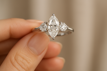 Elegant Marquise Cut Lab-Grown Diamond Trilogy Ring with Pear & Round Accents - in hand